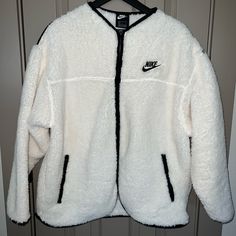 Beautiful & So Clean Nike Women’s Fleece Wear Jacket Size Large Euc As I Wore It Only 3 Short Period Of Time. Safe To Say It’s 97% Nwot No Flaws Of Any Kind Side Zipper Pockets Front Zipper & V Neck Runs A Bit Oversized Unless Your Wearing Anything That’s A Medium To Thicker Shirt Underneath It. I’m 5’4 And The Back Of It Was A Bit Bigger On Me Along With Just A Bit Longer Then I Like. I Absolutely This Jacket Because It’s Such A Clean White Color With Perfect Black Accents. I Was Just Too Worri Sporty Sherpa Fleece Jacket For Cold Weather, Nike Cozy Winter Outerwear, White Fleece Track Jacket For Outdoor, Nike Long Sleeve Winter Track Jacket, Nike Fleece Jacket With Fleece Lining, Nike Long Sleeve Track Jacket For Winter, Nike Winter Long Sleeve Track Jacket, Nike Winter Track Jacket Long Sleeve, Nike Winter Track Jacket With Long Sleeves