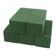 four green foam blocks stacked on top of each other