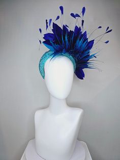 From the 2024 Featured Milliner of the Kentucky Derby Museum  Gorgeous Kentucky Derby hat fascinator  kentucky derby hat fascinator aqua blue swarovski crystal headband with navy blue spike feather and large navy royal blue feathers headband attachment each hat is totally one of a kind! no two are alike! I can probably add feathers, flowers etc to existing hats for a small fee. I cannot remove anything from existing hats. Just message me and see if we can make it work! :) I cannot make custom or Luxury Blue Feathered Headpiece, Luxury Blue Headpieces For Races, Blue Feather Trim Headpiece For Kentucky Derby, Blue Feather Headpiece For Kentucky Derby, Blue Feathered Headpiece For Kentucky Derby, Fitted Blue Headpieces With Feathers, Blue Feathered Headpiece For Party, Blue Headpieces For Carnival, Adjustable Blue Feather Headpiece