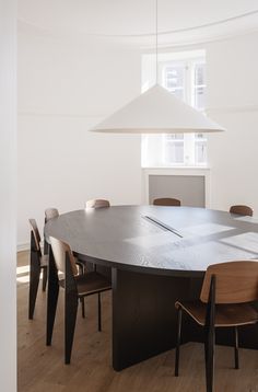 a large round table with chairs around it