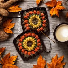 two crocheted coasters sitting on top of a wooden table next to a cup of milk