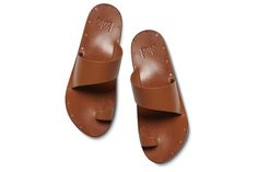 Made entirely of 100% leather – from the asymmetrical upper and toe ring, to the lining, and even the sole – each pair of FINCH leather toe-ring sandals is a testament to quality and craftsmanship. Slip them on, and within hours, they'll mold to your feet like they were tailor-made just for you. Plus, with a molded arch for comfort and support, you'll cruise all day with ease. Our commitment to sustainability is evident in our use of vegetable-tanned leathers, recycled and recyclable products, p Leather Mules With Single Toe Strap, Leather Mules With Heel Loop And Single Toe Strap, Summer Leather Toe Loop Mules, Leather Toe Loop Mules For Summer, Summer Leather Toe Ring Sandals With Heel Loop, Leather Toe Loop Sandals With Leather Footbed, Leather Toe Loop Mules With Leather Sole, Leather Mules With Heel And Toe Loops, Toe Ring Sandals