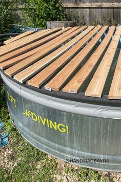 Cedar planks are laid across a stock tank and trimmed to fit the circular tank. Stock Tank Pool Cover Ideas, Heated Stock Tank Pool, Poly Stock Tank Pool Ideas, Stock Tank Pool Landscaping, Stock Tank Pool Deck, Stock Tank Pool Cover, Stock Tank Pools, Stock Tank Pool Ideas, 10ft Pool