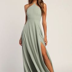 a woman in a long dress with a slit