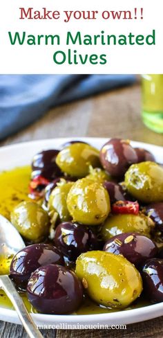 an image of olives on a plate with the words make your own warm marinated olives