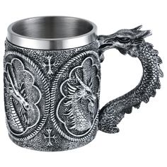 a dragon mug with an intricate design on it