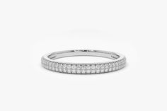 a white gold wedding band with rows of diamonds