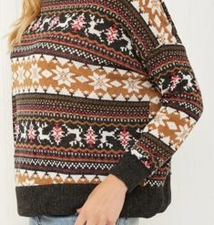 Keep cozy and stylish this winter with our lightweight turtleneck sweater. Its unique brown winter/holiday print adds a touch of whimsy to any outfit, making it the perfect seasonal must-have. Stay warm and make a statement with this playful sweater. Be holiday ready with this Fair Isle sweater! The pattern features reindeer and snowflakes in an alternating design, and the sweater has a turtleneck for extra warmth. Neckline: Turtleneck Length: Regular Sleeve length: Long sleeves Sleeve type: Dro Cozy Warm Brown Top, Warm Brown Knit Tops, Warm Brown Sweater For Fall, Winter Brown Tops With Fair Isle Pattern, Winter Fair Isle Pattern Brown Tops, Brown Fair Isle Winter Top, Winter Soft Knit Brown Top, Brown Crew Neck Top With Fair Isle Pattern, Brown Soft Knit Top For Winter