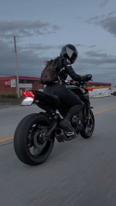 a person riding on the back of a motorcycle