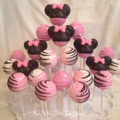 minnie mouse cake pops with pink and black frosting