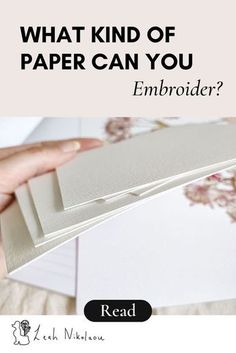 a person is holding some papers with the words what kind of paper can you embroider?