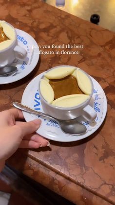 two plates with desserts on them sitting on a counter top next to each other