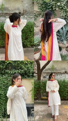 the woman is wearing white clothes and posing in front of some plants with her hands on her head