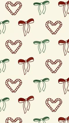 a pattern with hearts and bows on a white background