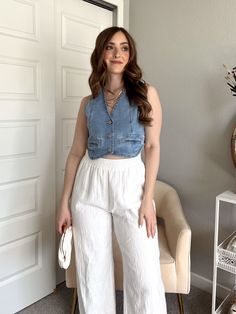 Introducing the Jolene cropped button up denim vest in light wash! This stylish piece features a front button closure and a structured fit that flatters your figure. Complete with faux front pockets and a high low cut in the back, this versatile vest can be worn all year round. Pair it with flowy linen pants or a skirt for the warmer months, or style it with a pair of dark denim or cargo pants for the colder months. Don't miss out on this must-have for any occasion! 72% Cotton 24% Polyester 3% Rayon 1% Spandex Color: Light wash denim Cropped length Front button closure Faux front pocket details Structured fit True to size Wash cold Hang to dry 5'5" - Bust: 34" - Waist: 26" Wearing a size small Product Measurements Small Medium Large Size 2 - 4 6 - 8 10 - 12 Bust 34" - 35" 36" - 37" 38" - 3 College Casual Outfits, Flowy Linen Pants, Flowy Pants Outfit, Denim Vest Outfit, Greece Outfit, Cute Outfits With Jeans, Flattering Outfits, Future Outfit, Fashion Hacks Clothes