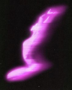 a blurry image of a woman's body in the dark with pink light