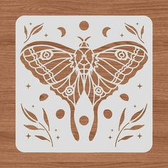 a cutout of a butterfly on a wooden surface