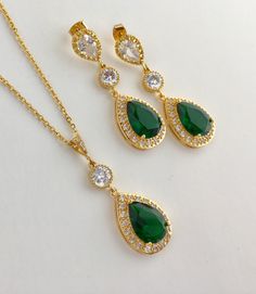 I've created these gorgeous green emerald cubic zirconia bridal tear drop earrings in gold plated brass setting. Earrings feature a large teardrop with pear cut green emerald cubic zirconia center surrounded by tiny round zirconia crystals. Teardrop dangles from a clear cubic zirconia ear stud and a round cubic zirconia connector. Total length of the earring is 4.8 cms. Also available in clip on style. For matching necklace click: https://www.etsy.com/listing/687185847/green-bridal-necklace-gree Green Wedding Jewelry, Bridesmaids Jewelry, Green Accessories, Tear Drop Earrings, Emerald Wedding, Green Jewelry, Ear Stud, Earrings Green, Zirconia Earrings