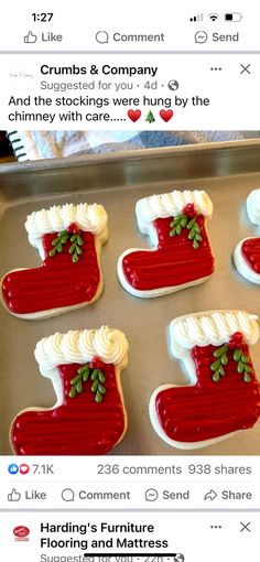 cookies decorated like christmas stockings and stockings are on a cookie sheet with white icing