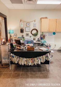 a table with clothes on it in a room filled with pictures and other things to do