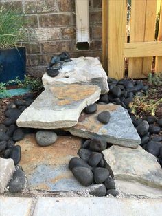 a rock garden with rocks and stones around it