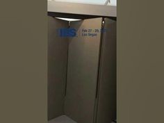 an image of a bathroom stall with the door open