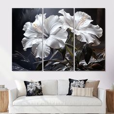 three white flowers on a black background in a living room