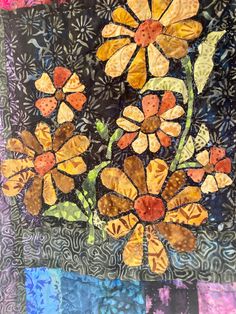 a quilt with flowers on it