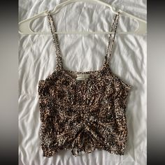 Urban Outfitters, Scrunch Cheetah Top With Tie To Loosen Or Tighten. Super Stretchy And Comfortable For Everyday Wear! Never Worn. Stretch Leopard Print Tops For The Beach, Leopard Print Cami Top For Spring, Summer Beach Leopard Print Tops, Leopard Print Cami Top For Summer, Summer Leopard Print Cami Top, Casual Stretch Tiger Print Tops, Casual Leopard Print Tops For Day Out, Casual Sleeveless Leopard Print Top, Trendy Leopard Print Cami Top