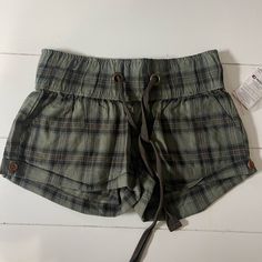 Light Weight Green And Brown Plaid Shorts, Pockets In The Front And Back. New With Tags, No Flaws And No Stains Trendy Plaid Short Bottoms, Trendy Short Plaid Bottoms, Summer Plaid Bottoms For Day Out, Cotton Beach Shorts With Adjustable Waist, Beach Shorts With Adjustable Waist In Cotton, Beach Bottoms With Adjustable Waist, Beach Bottoms With Adjustable Waist And Short Shape, Casual Plaid Shorts, Adjustable Waist Shorts For Beach