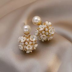 Exclusive classic style various earrings for brides.  Decorated with pearls and zircon.  Earrings decorated with flower blossoms will go well with any bridal dress.  It's a great choice to be unique.  Gives a sense of luxury. When placing an order, you must specify your phone number.  otherwise the parcel will not be sent. Luxury White Pearl Flower Earrings, Luxury Pearl Flower Earrings, White Elegant Flower Earrings, Luxury Elegant White Flower Earrings, Luxury Classic White Flower Earrings, Luxury White Flower Bridal Earrings, Elegant Pearl Earrings With 3d Flowers, White Pearl Cluster Earrings For Wedding, Elegant White Round Flower Earrings