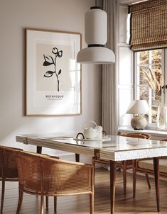 a dining room with a table and chairs in front of a window that reads do it now