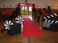 a red carpet with black and white signs on it