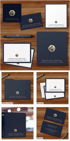 several different types of business cards and envelopes on a wooden surface with gold accents