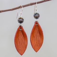 Working with leather Thai artisan Chaloemphon creates fabulous jewelry with contemporary flair. These earrings feature supple leather petals in rust topped by polished beads of tiger's eye. The earrings swing from polished sterling silver hooks. Handmade Rust Leather Jewelry, Brown Leather Teardrop Jewelry, Petal Earrings, Leather Wristbands, Braided Leather Bracelet, Tiger Eye Beads, Fabulous Jewelry, Leather Wrap Bracelet, Tiger's Eye