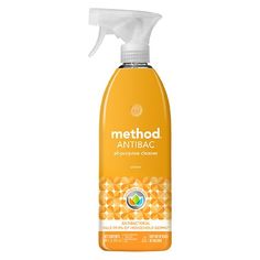 a bottle of method antibac spray on a white background with an orange and yellow pattern