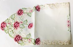 a white sheet with pink flowers on it