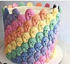 a rainbow colored cake with skulls on it