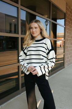 This soft sweater runs true to size with an oversized fit. Our model is wearing a size small. Trendy Cozy White Sweater, White Cozy Fit Trendy Sweater, Oversized Soft Knit Sweater For Day Out, Trendy White Cozy Fit Sweater, Trendy White Comfortable Sweater, Cozy White Trendy Sweater, Fall Sweatshirt For Day Out With Relaxed Fit, Chic Relaxed Fit Sweatshirt For Fall, Chic Oversized Sweatshirt