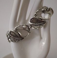 "Vintage Sarah Coventry silver tone bracelet, link leaf shaped, 7.5\" signed, fold over clasp, in excellent condition." Formal Silver Chain Bracelet With Clasp, Formal Metal Bracelets With Clasp, Silver Metal Chain Bracelet With Clasp, Silver Hinged Metal Bracelets, Sarah Coventry, Bracelet Vintage, Coventry, Leaf Shapes, Fold Over