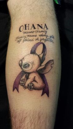 a man with a tattoo on his arm that says ohana and has a teddy bear holding a purple ribbon