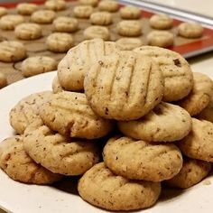 a pile of cookies sitting on top of a white plate