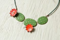 "Prickly Pear Cactus Necklace, Enamel Necklace, Cactus Necklace, Cactus Flower, Statement Necklace, Cacti, Desert Necklace, Succulents, The prickly pear inspired this enamel necklace, imitating the body and the flowers. Natural shapes reflected in the forms of jewelry. The the flowers on the necklace made from enamelled copper. The body of the cactus cut from copper embossed and enamelled. The flowering cactus give unique fresh and funny appearance to this statement necklace. The length of the enamelled parts (cactus) 11cm / 4,2\" The form of the necklace is cut by hand with shear. Absolutely handmade unit. Shipping Informations. To Europe the delivering time is about 4-5 workdays, to USA about 12-14 workdays. To worldwide about 12-14 workdays. Shipped in a safety little box package in cas Flame Painting, Flowering Cactus, Cactus Jewelry, Cactus Necklace, Pear Cactus, Flower Statement Necklace, Prickly Pear Cactus, Enamel Necklaces, Prickly Pear