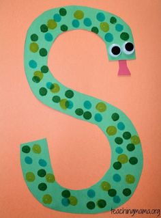 the letter s is made out of paper with polka dots on it and an image of a