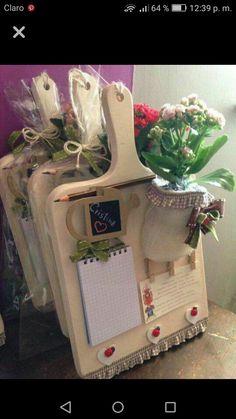 a photo frame with flowers and notes attached to it