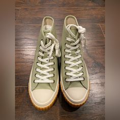 Nib J.Crew Classic Canvas High Top Sneakers Size- 7 Color- Pistachio Ivory. Say Hello To Our Newest Sneakera Classic Canvas High-Top. With A Durable, Vulcanized Rubber Sole And Cushy Footbed, They're Comfy Enough To Wear Everydayfrom Coffee Runs To Dog Walks And Everything In Between. Feel-Good Fact: This Canvas Is Made From 65 Percent Recycled Materials. Cotton Upper And Lining. Rubber Sole. Sold Out Online! The Perfect Statement Sneaker! Casual Khaki Lace-up High-top Sneakers, Khaki Lace-up Sneakers For Spring, Khaki Low-top Spring Sneakers, Green High-top Sneakers With Round Toe For Spring, Khaki Lace-up High-top Sneakers With Rubber Sole, Casual High-top Khaki Sneakers, Casual Khaki High-top Lace-up Sneakers, Green High-top Sneakers With Vulcanized Sole For Spring, Spring Green High-top Sneakers With Rubber Sole