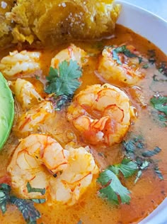 a white bowl filled with shrimp and tortilla soup