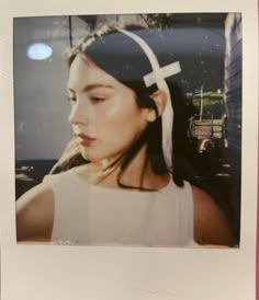 a woman with a cross on her head