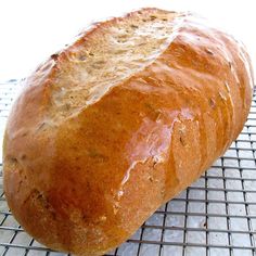 a loaf of bread sitting on top of a cooling rack