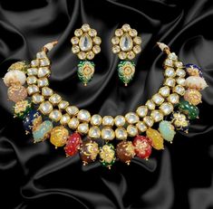 Product Description: * Multi-Color Kundan Gold Plated choker set/Designer sabyasachi inspired kundan set/Kundan wedding set/Sabyasachi Jewelry/Light Kundan set * The base metal color is Gold tone studded with kundan along with beads work on it. * This Jewelry set would add more charms to your beautiful jewelry collection and would surely bring lots of compliments . * Note:- This is an artificial Jewelry Set. * Care Instructions: Keep it dust-free & dirt free in a plastic pouch. Remember to apply Earring Bride, Jewel Pendant, Kundan Necklace Set, Sabyasachi Jewellery, Kundan Jewelry, Kundan Choker, Choker Gold, Kundan Necklace, Bollywood Jewelry